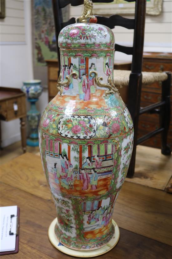 A pair of large 19th century Chinese famille rose vases and cover, 67.5cm high, repaired